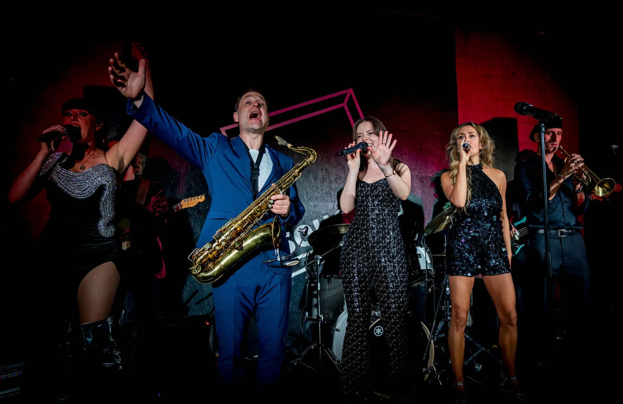The Secret Sax Party band and singers performing